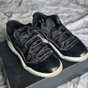Jordan 11 Black Low-Top Patent Leather Sneakers
